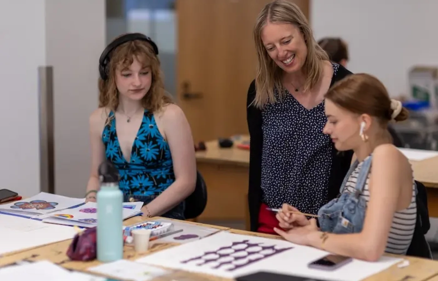 Professor and students looking at color samples