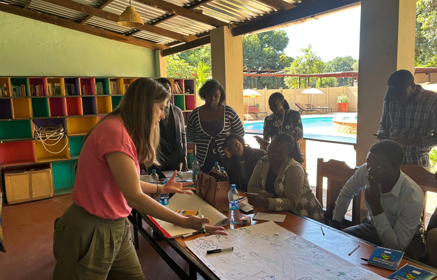 Laura Peters works with community members in a classroom in Zambia.