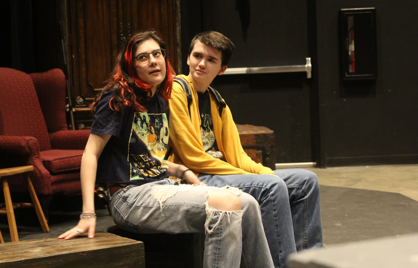Actors sitting on stage
