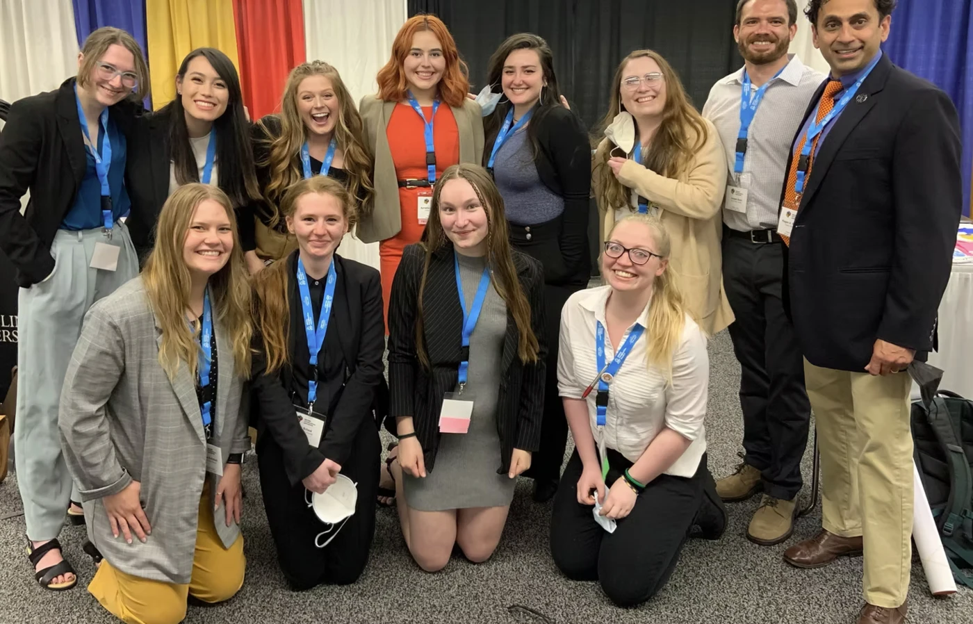 A group of students posing for a photo at an academic conference.
