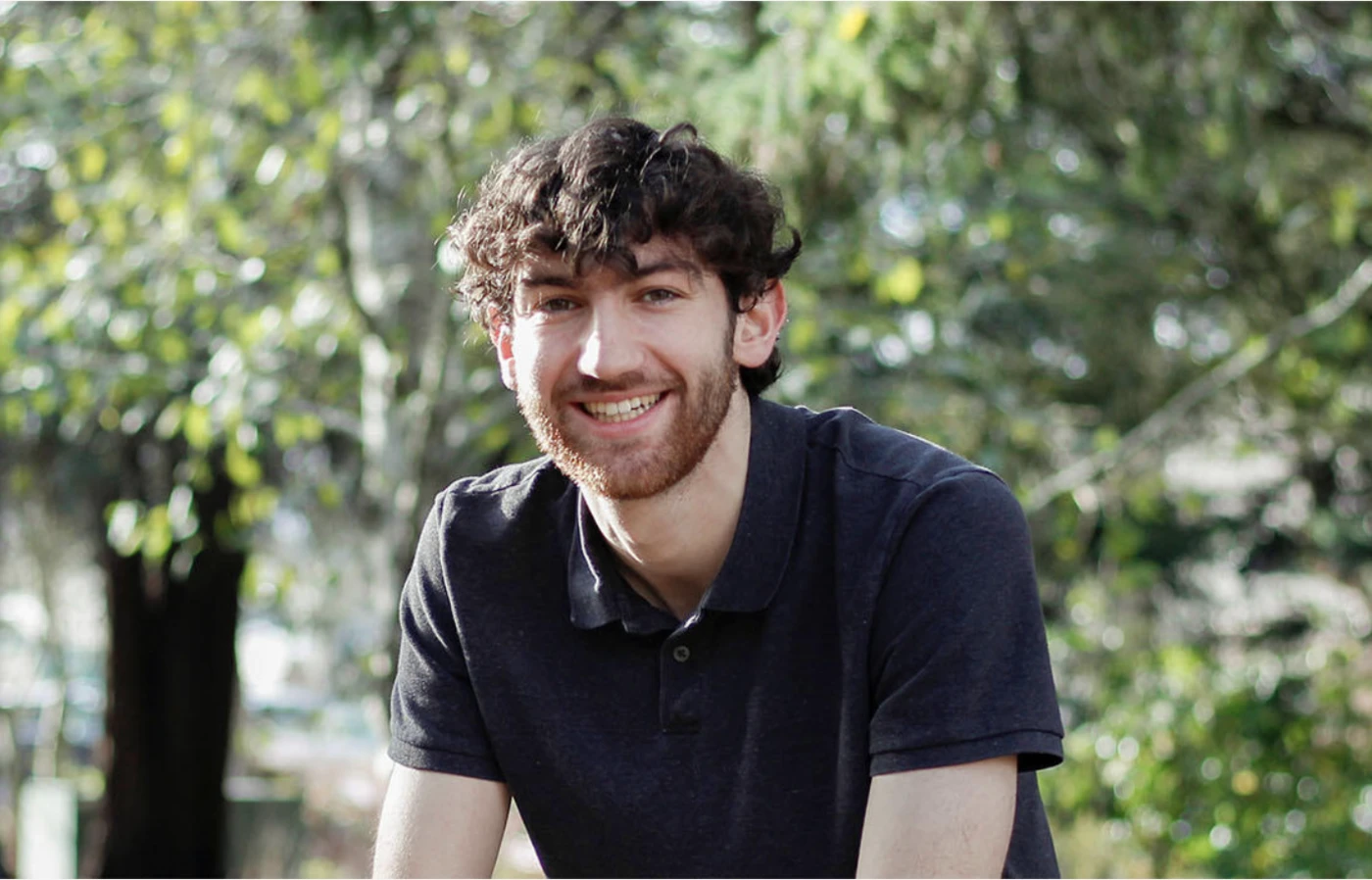 Outdoor headshot of Tias Carney