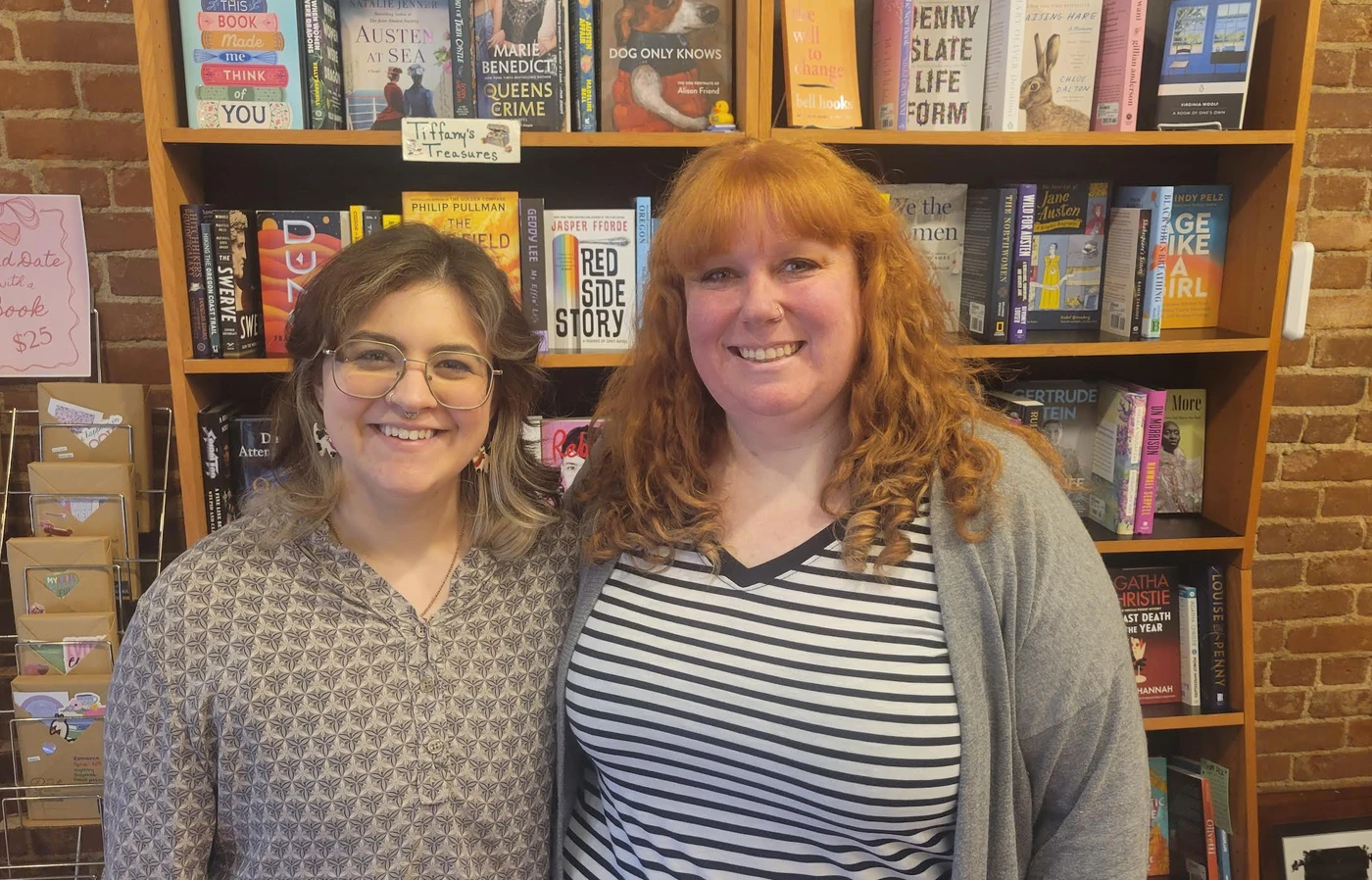 Two of the three new owners of Grass Roots Books