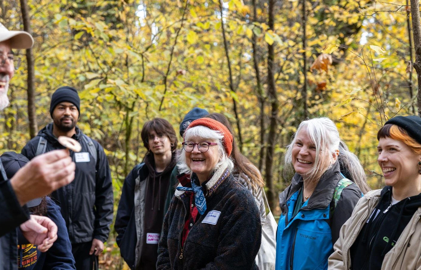 Group of people smiling in the forest