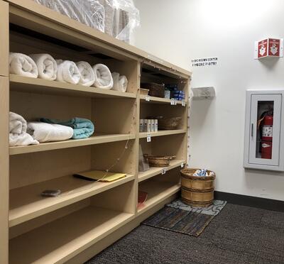 Shelves holding hygiene items in the Basic Needs Center.