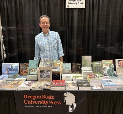 Man standing at book booth