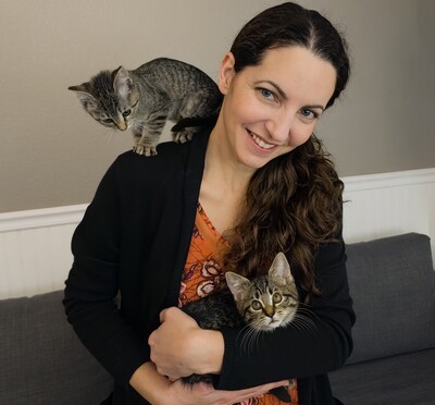 Portrait of researcher with two kittens