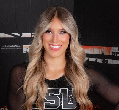 Samantha LeFore smiling in her cheer outfit