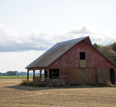 Red barn in field