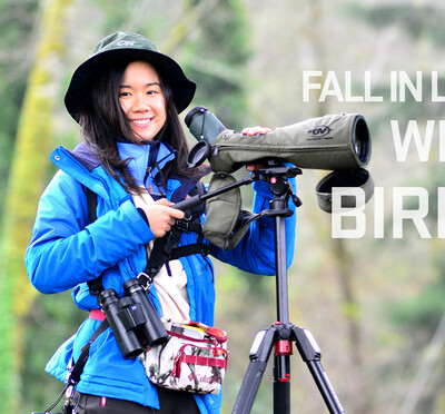 Fang-Yu Shen with a telescope, binoculars and a smile while birdwatching.