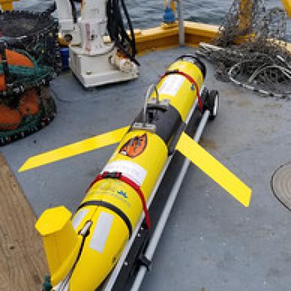 Bright yellow ocean glider to collect scientific data in the ocean.