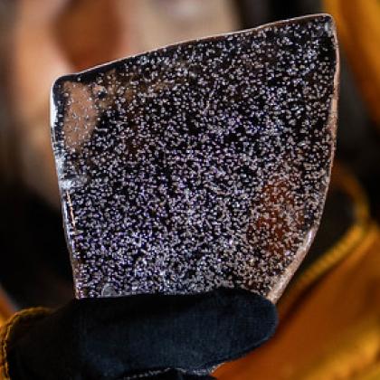 Up close image of slice of Antarctic ice core that shows air bubbles containing ancient gasses