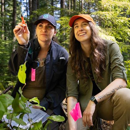 Using a blend of western science and Indigenous Knowledge, Ashley Russell, left, and Tessa Chesonis survey random areas in the forest. Russell is the interim director of culture and natural resources for the Confederated Tribes of the Coos, Lower Umpqua, 
