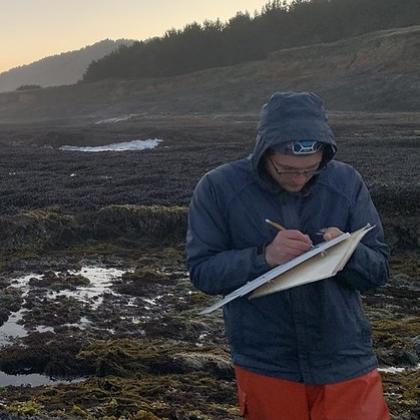 Zechariah Meunier of OSU conducts rocky shore surveys in California. Photo by Risa Askerooth.