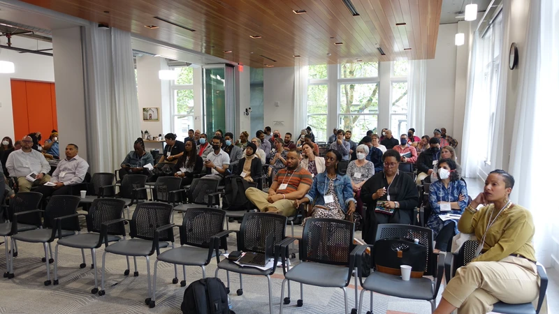 A room full of attendees sitting in rows of chairs at the State of Black Affairs Summit.