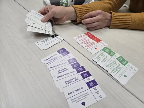 The playing cards for the Parking Game spread across a table.