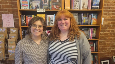 Two of the three new owners of Grass Roots Books
