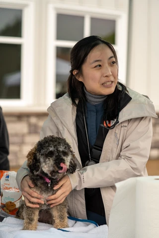 Vet holding dog