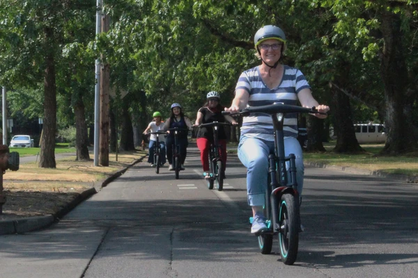 Riders bike on rental bikes