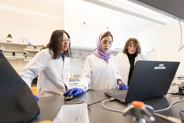 Researchers in lab coats