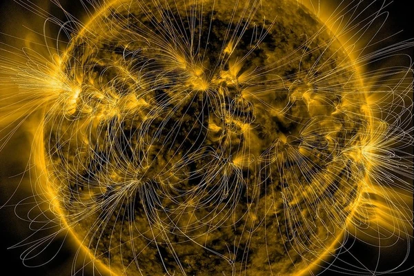 A glowing depiction of the sun’s magnetic fields is overlaid on an image of the sun captured in extreme ultraviolet light by NASA’s Solar Dynamics Observatory on March 12, 2016.