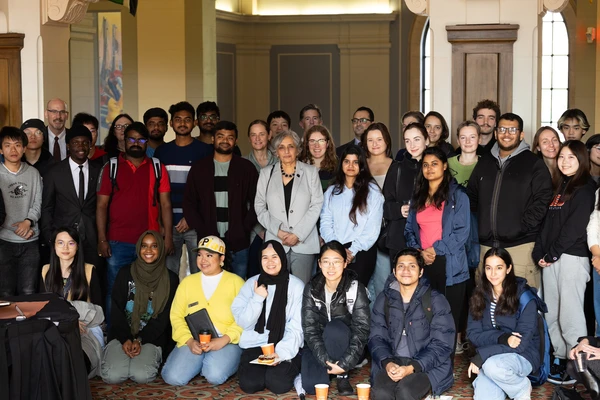 President Murthy poses with a large group of international students during the president's reception for International Education Week 2023