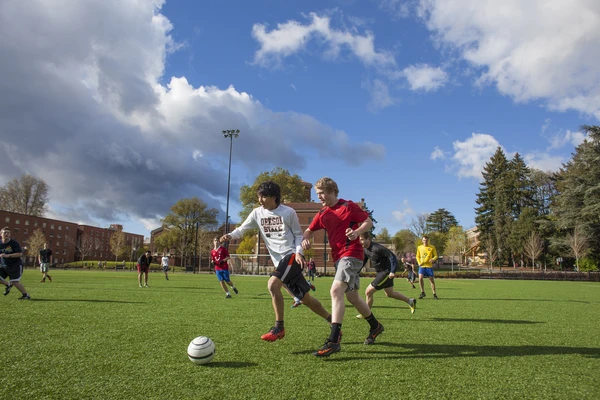 Students playing soccer