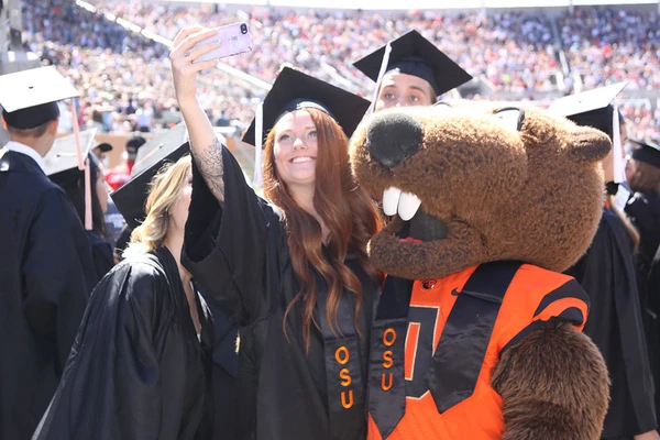 Students with Benny at commencement