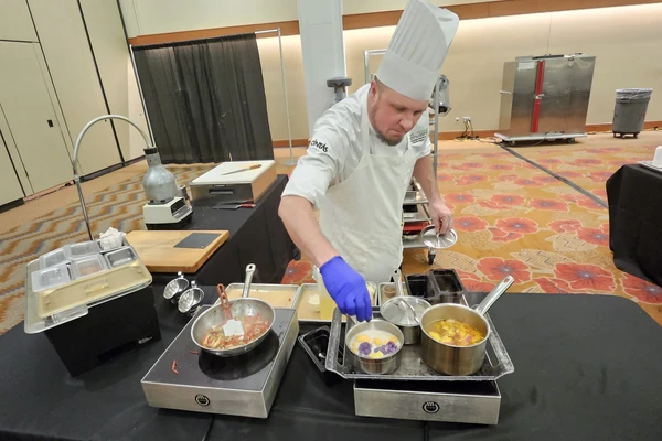 Sous chef preparing meal