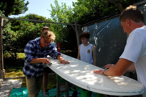 People working on boards
