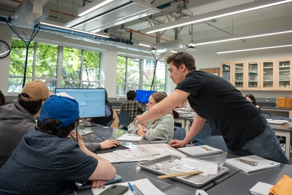 Students at a table working on a project