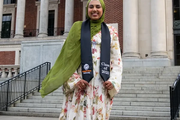 Portrait of graduate on MU steps
