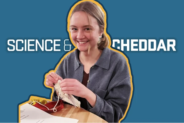 Clara Schmidt grins while knitting, superimposed over a blue background with the title "Science and Cheddar."