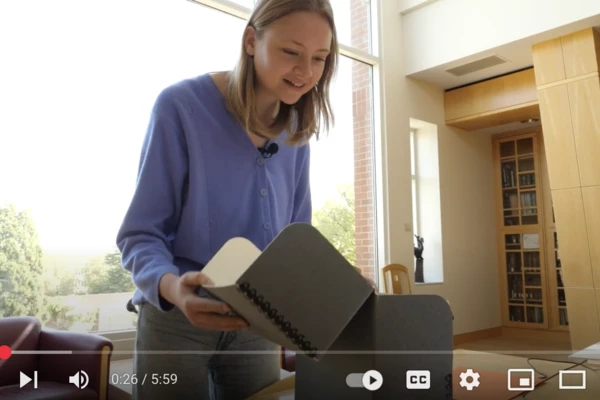 YouTube screen capture of student doing research in the archives