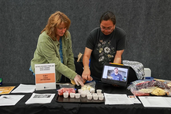 People at table with food samples