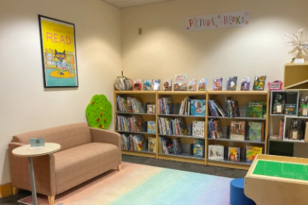 Room with children's books and couch