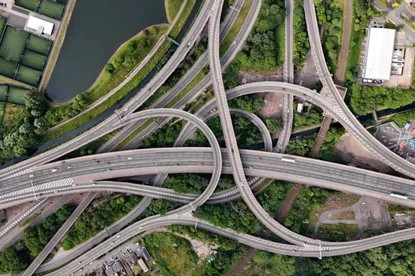 Aerial view of a tangle of highways crisscrossing each other.