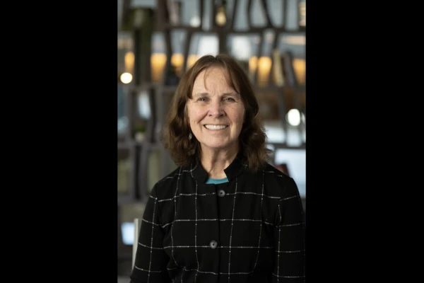 Headshot of Dr. Sue Tornquist in a dark-colored coat. 