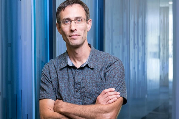 Researcher with arms folded