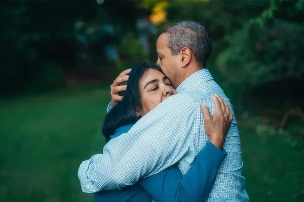 Two people hugging